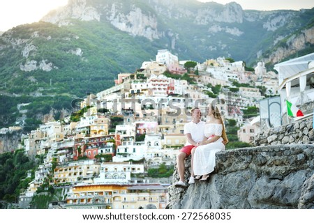 happy young couple bride and groom relaxing in Positano, Amalfi coast, Italy