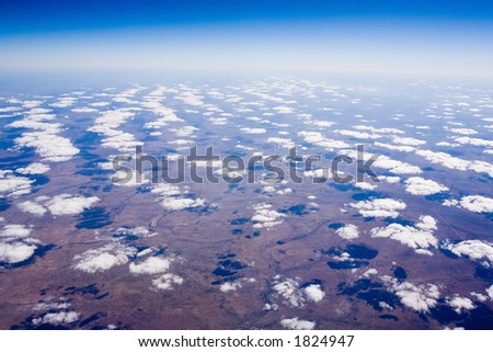 Cloudy landscape - as seen from a plane\'s window
