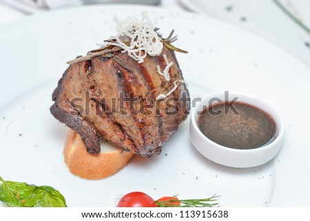 steak sauce garnished with dill and tomato