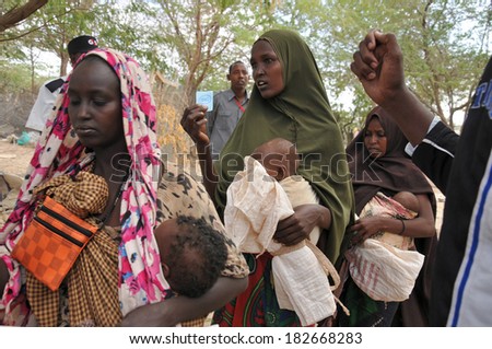 DADAAB, SOMALIA - AUGUST 7 Unidentified women and men live in the Dadaab refugee camp hundreds of thousands of Somalis wait for help because of hunger on August 7, 2011 in Dadaab, Somalia
