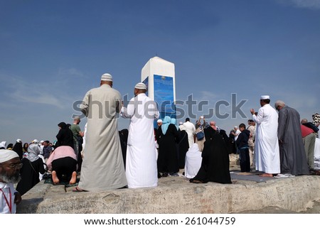 MECCA, SAUDI ARABIA - FEB 3: Muslims at Mount Arafat (or Jabal Rahmah) February 3, 2015 in Arafat, Saudi Arabia. This is the place where Adam and Eve met after being overthrown from heaven.