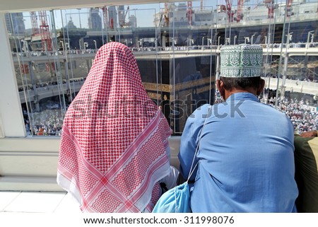 MECCA, SAUDI ARABIA - FEBRUARY 2: Muslims praying on the top floor of the Kaaba on February 2, 2015 in Mecca, Saudi Arabia. Muslim people praying together at holy place.