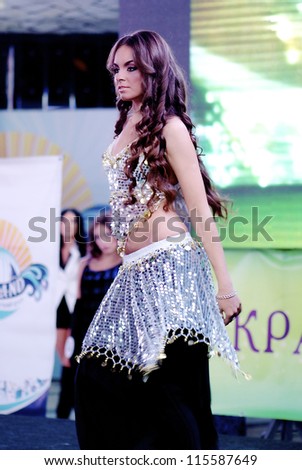 ST. PETERSBURG, RUSSIA - OCTOBER 13: Beautiful brunette girl dances indian dance  during final stage of the contest Russian Beauty on October 13, 2012, in St.Petersburg, Russia