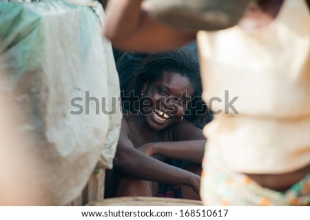 GHANA - MARCH 2, 2012: Unidentified Ghanaian woman smiles for the camera in Ghana, on March 2nd, 2012. People in Ghana suffer from poverty due to the slow development of the country