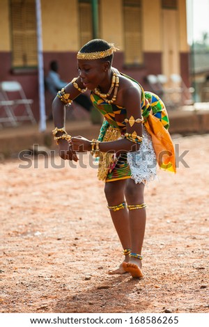 GHANA - MARCH 3, 2012: Unidentified Ghanaian girl dances traditional African dance in Ghana, on March 3rd, 2012. Music is the main kind of entertainment in Africa