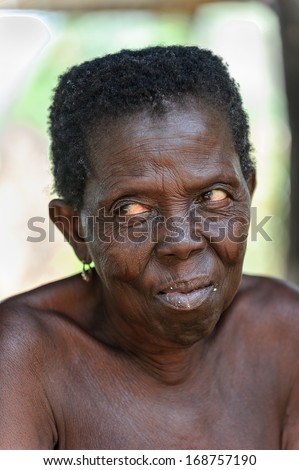 BENIN, MARCH 8, 2012: Unidentified Beninese old woman in Benin, Mar 8, 2012. People of Benin suffer of poverty due to the unstable economical situation