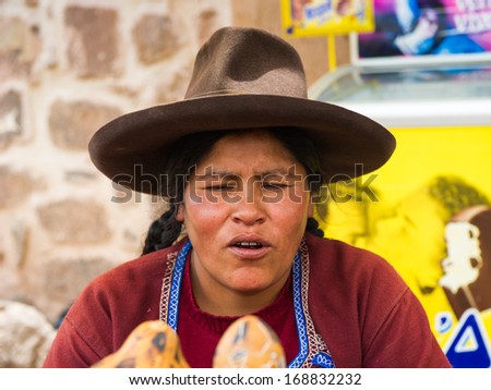PERU - NOVEMBER 6, 2010: Unidentified Peruvian woman in traditional hat work at the local market in Peru, Nov 6, 2010. Over 50 per cent of people in Peru live below the the poverty line.