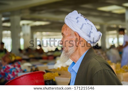 SAMARKAND, UZBEKISTAN - JUNE 10, 2011: Portrait of unidentified Uzbek man with beard and turban in Uzbekistan, Jun 10, 2011. 93% of Uzbek people consider that life in the country goes well.
