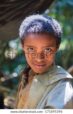 OMO VALLEY, ETHIOPIA - SEP 20, 2011: Unidentified Ethiopian serious little boy in Ethiopia, Sep.20, 2011. People in Ethiopia suffer of poverty due to the unstable situation