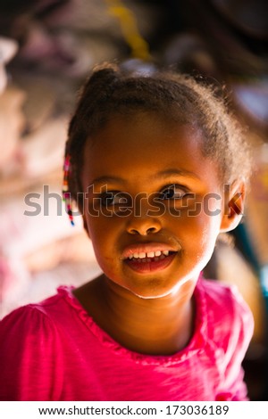 AKSUM, ETHIOPIA - SEP 30, 2011: Portrait of an unidentified Ethiopian woman with traditional pigtails in Ethiopia, Sep.30, 2011. People in Ethiopia suffer of poverty due to the unstable situation