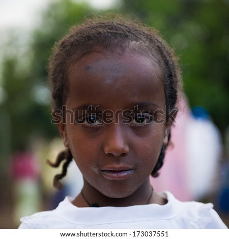 AKSUM, ETHIOPIA - SEP 27, 2011: Portrait of an unidentified Ethiopian child wearing old clothes in Ethiopia, Sep.27, 2011. Children in Ethiopia suffer of poverty due to the unstable situation
