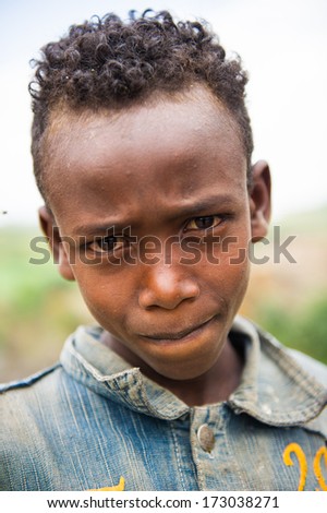 AKSUM, ETHIOPIA - SEP 24, 2011: Portrait of an unidentified Ethiopian boy in Ethiopia, Sep.24, 2011. People in Ethiopia suffer of poverty due to the unstable situation