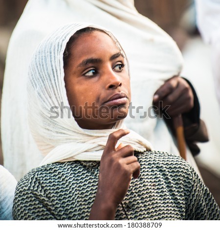 LALIBELA, ETHIOPIA - SEPTEMBER 28, 2011: Unidentified Ethiopian woman wears a tissue. People in Ethiopia suffer of poverty due to the unstable situation