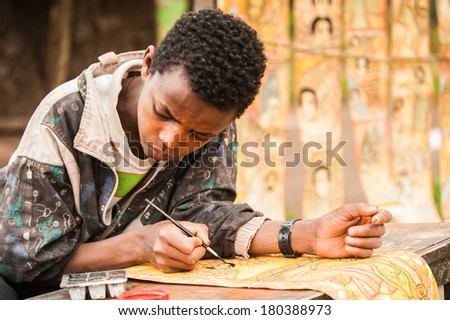 LALIBELA, ETHIOPIA - SEPTEMBER 27, 2011: Unidentified Ethiopian boy draws near the Lalibela church cut off the rock. People in Ethiopia suffer of poverty due to the unstable situation