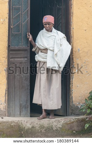 LALIBELA, ETHIOPIA - SEPTEMBER 27, 2011: Unidentified Ethiopian womanat the porch. People in Ethiopia suffer of poverty due to the unstable situation.