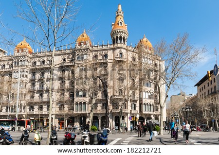 BARCELONA, SPAIN - MAR 15, 2014: Architecture on the Passeig de Gracia in Barcelona, Spain.  It\'s one of the most important shopping and business areas in the city