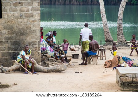 PORTO-NOVO, BENIN - MAR 9, 2012: Unidentified Beninese people at the local market. Children of Benin suffer of poverty due to the difficult economic situation