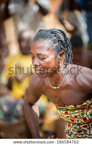KARA, TOGO - MAR 11, 2012:  Unidentified Togolese woman in traditional dress dance the religious voodoo dance. Voodoo is the West African religion