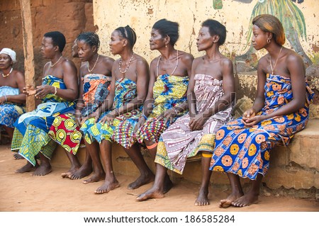 KARA, TOGO - MAR 11, 2012:  Unidentified Togolese women watch the religious voodoo dance performance. Voodoo is the West African religion