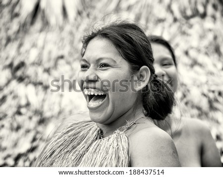 AMAZONIA, PERU - NOV 10, 2010: Unidentified Amazonian indigenous two women laugh. Indigenous people of Amazonia are protected by COICA Coordinator of Indigenous Organizations of the Amazon River Basin