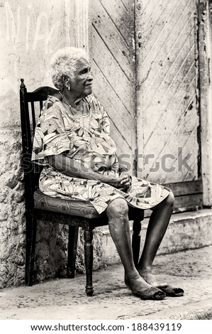 PANAMA CITY, PANAMA, JANUARY 9, 2012: Unidentified Panamian woman sits on a chair on the chair. 70% of the Panama people are mestizos