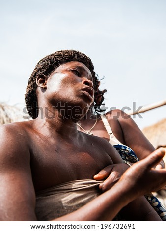 KARA, TOGO - MAR 11, 2012:  Unidentified Togolese woman dances the religious voodoo dance. Voodoo is the West African religion