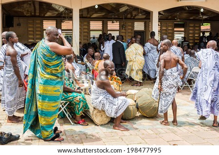 ACCRA, GHANA - MARCH 4, 2012: Unidentified Ghanaian people after the  local street music show in Ghana. People of Ghana suffer of poverty due to the unstable economic situation