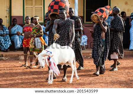 ACCRA, GHANA - MARCH 4, 2012: Unidentified Ghanaian man makes a performence with a goat in Ghana. People of Ghana suffer of poverty due to the unstable economic situation