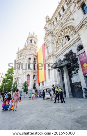 MADRID, SPAIN - JUN 19, 2014: Unidentified Spanish people in the centre of Madrid on a case the celebration on a day of the inauguration of the New King of Spain Felipe IV