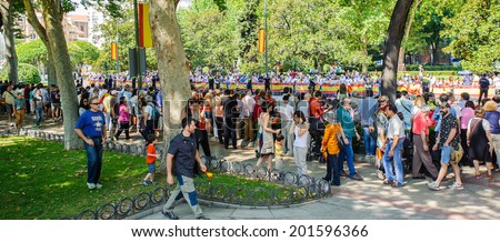 MADRID, SPAIN - JUN 19, 2014: Unidentified Spanish people in the centre of Madrid during the celebration of the coronation of the New King of Spain Felipe IV