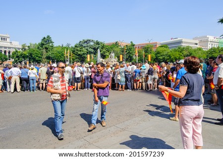 MADRID, SPAIN - JUN 19, 2014: Unidentified Spanish people in the centre of Madrid on a case the celebration on a day of the inauguration of the New King of Spain Felipe IV