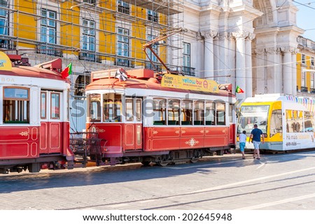 LISBON, PORTUGAL - JUN 20, 2014: Electric tramway on the Commerce Square (Praca do Comercio) in Lisbon, Portugal. The Square was destoryed by the 1755 Lisbon Earthquake and then it was reconstructed