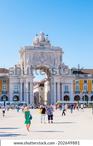 LISBON, PORTUGAL - JUN 20, 2014: Rua Augusta Arch on the Commerce Square (Praca do Comercio) in Lisbon, Portugal. The Square was destoryed by the 1755 Lisbon Earthquake and then it was reconstructed