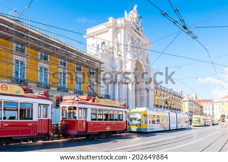 LISBON, PORTUGAL - JUN 20, 2014:  Electric tramway on the Commerce Square (Praca do Comercio) in Lisbon, Portugal. The Square was destoryed by the 1755 Lisbon Earthquake and then it was reconstructed