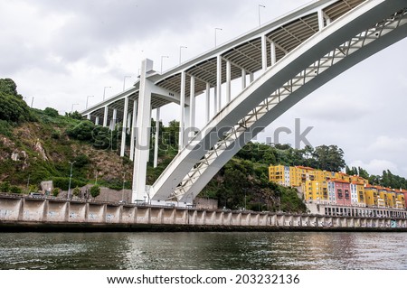 PORTO, PORTUGAL - JUN 21, 2014: Bridge ove the River Douro in Porto, Portugal. View from the River Douro, one of the major rivers of the Iberian Peninsula (2157 m)