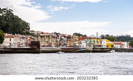 PORTO, PORTUGAL - JUN 21, 2014: Houses on the bank of the River Douro in Porto, Portugal. View from the River Douro, one of the major rivers of the Iberian Peninsula (2157 m)
