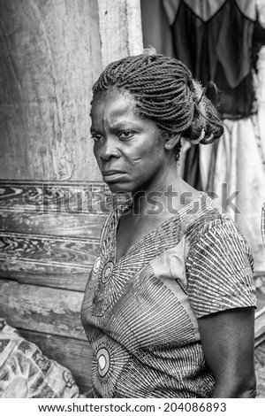 ACCARA, GHANA - MAR 3, 2012: Unidentified Ghanaian woman portrait in black and white. People of Ghana suffer of poverty due to the unstable economical situation