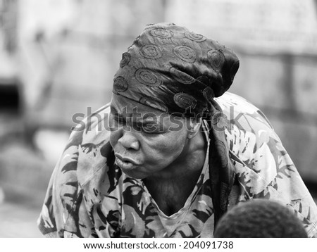 ACCARA, GHANA - MAR 4, 2012: Unidentified Ghanaian woman portrait in black and white. People of Ghana suffer of poverty due to the unstable economical situation