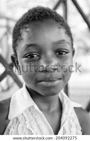 ACCARA, GHANA - MAR 3, 2012: Unidentified Ghanaian girl portrait in black and white. People of Ghana suffer of poverty due to the unstable economical situation
