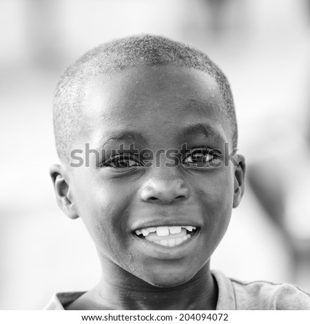 ACCARA, GHANA - MAR 2, 2012: Unidentified Ghanaian boy portrait in black and white. People of Ghana suffer of poverty due to the unstable economical situation