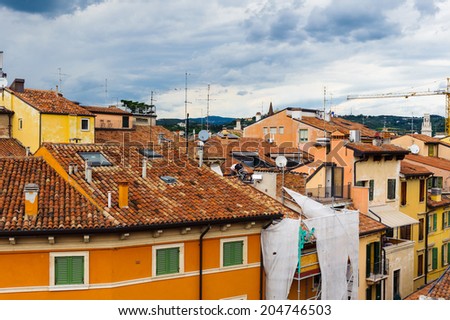 VERONA, ITALY - JUN 26, 2014: Panorama of the roof tops of Verona, Italy. City of Verona is a UNESCO World Heritage site