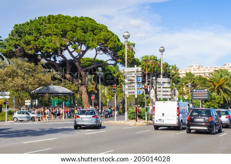 NICE, FRANCE - JUNE 25, 2014: Traffic of the Promenade des Anglais, Nice, France. Nice is the capital of the Alpes Maritimes departement