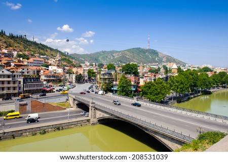 TBILISI, GEORGIA - JULY 18, 2014: Architecture and traffic of Tbilisi, Georgia. Tbilisi is the capital and the largest city of Geogia with 1,5 mln people population