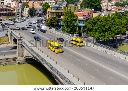 TBILISI, GEORGIA - JULY 18, 2014: Bridge over the river  of Tbilisi, Georgia. Tbilisi is the capital and the largest city of Geogia with 1,5 mln people population