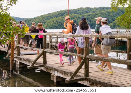 PLITVICE LAKE NATIONAL PARK, CROATIA - AUG 19, 2014: Unidentified people in  getting on board in the Plitvice Lakes National Park, which is a UNESCO World Heritage site