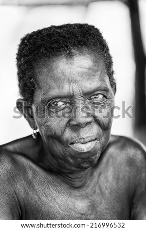 PORTO-NOVO, BENIN - MAR 8, 2012: Portrait of unidentified Beninese old woman. People of Benin suffer of poverty due to the difficult economic situation.