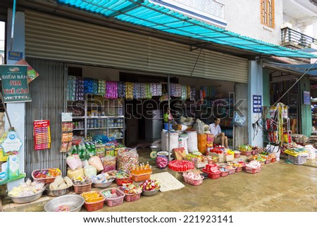 BAC HA, VIETNAM - SEP 21, 2014: Tents of the Bac Ha Market, a large Sunday market with people wearing beautiful colored minorities costumes