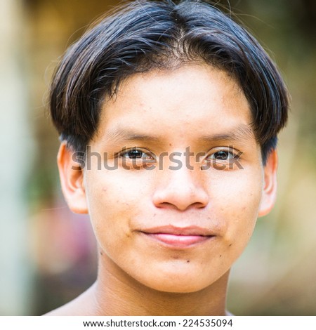 AMAZONIA, PERU - NOV 10, 2010: Unidentified Amazonian indigenous boy portrait. Indigenous people of Amazonia are protected by  COICA (Coordinator of Indigenous Organizations of the Amazon River Basin)