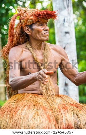 AMAZONIA, PERU - NOV 10, 2010: Unidentified Amazonian indigenous man portrait. Indigenous people of Amazonia are protected by  COICA (Coordinator of Indigenous Organizations of the Amazon River Basin)