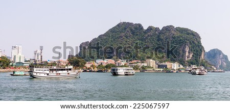 HA LONG CITY, VIETNAM - SEP 23, 2014: Touristoc Boats near the port of the Halong city where many touristic boats start jorneys over the Halong bay which is UNESCO World heritage